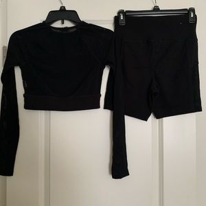Forever 21 matching black work out set with mesh on sleeves and shorts, size M